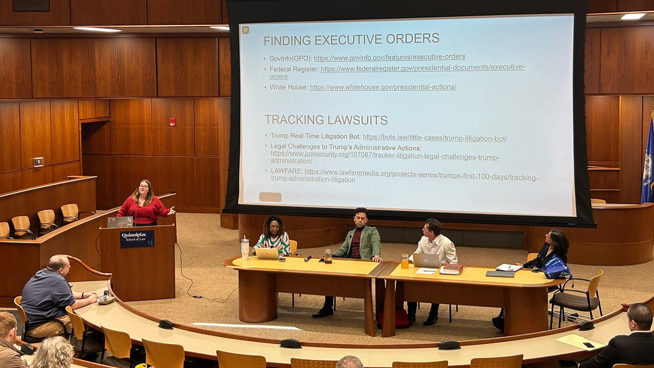 Panelists discuss executive orders in the School of Law.