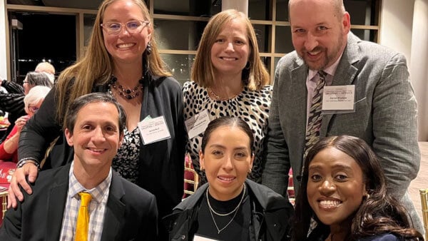 Quinnipiac Law alumni posing for a picture at an event