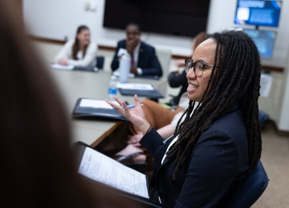 Law student studying and engaging in class