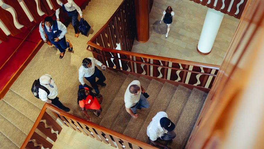 Law students walk up the stairs to the Lynne L. Pantalena Law Library.