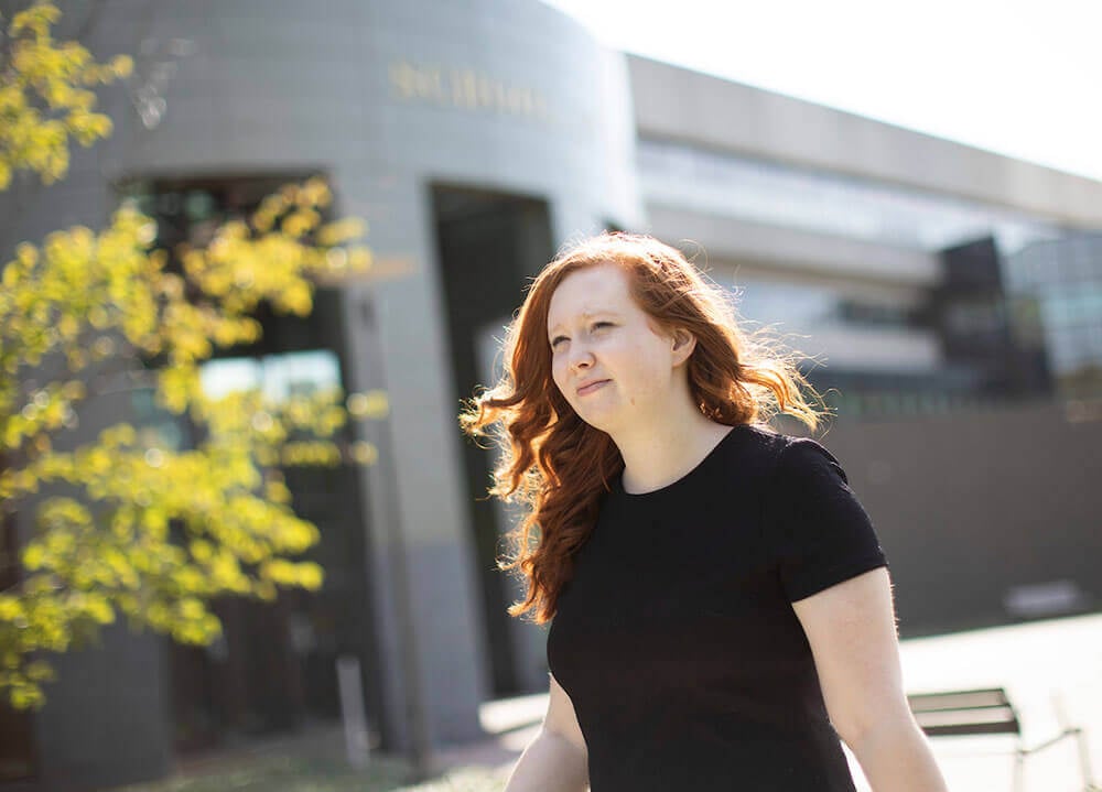 Law student Nicole Dwyer is pictured outside the main entrance of the School of Law Center