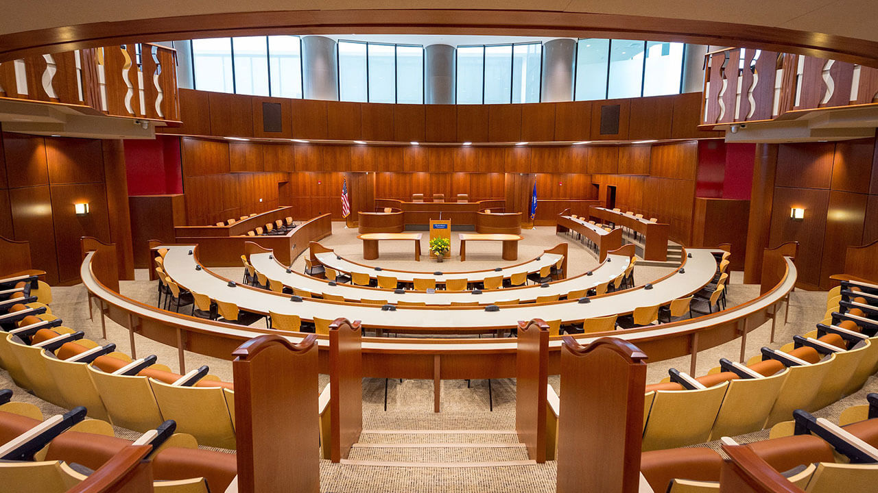 Shot of the entire School of Law Ceremonial Courtroom, featuring the judge's bench, witness stand, audience seating