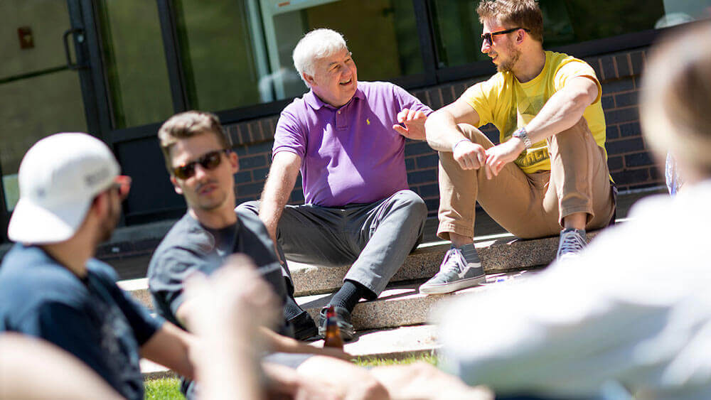 School of Law professors and students interact informally during an end of year barbecue