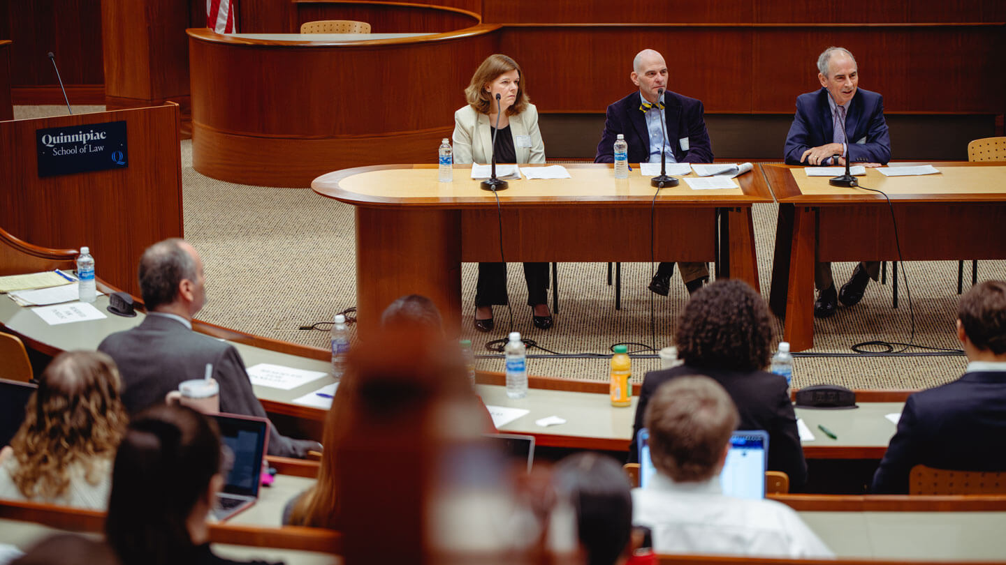 A panel discussion at the Quinnipiac University Ceremonial Courtroom.